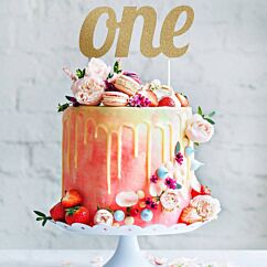 Kulta-glitteri kakkukoriste tekstillä "one".