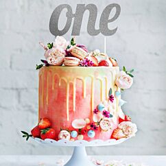 Hopea-glitteri kakkukoriste tekstillä "one".