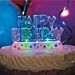 Vilkkuva kakkukoriste tekstillä "Happy Birthday"
